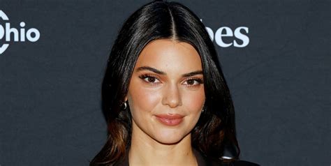 Kendall Jenner poses totally nude in a set of Christmas lights